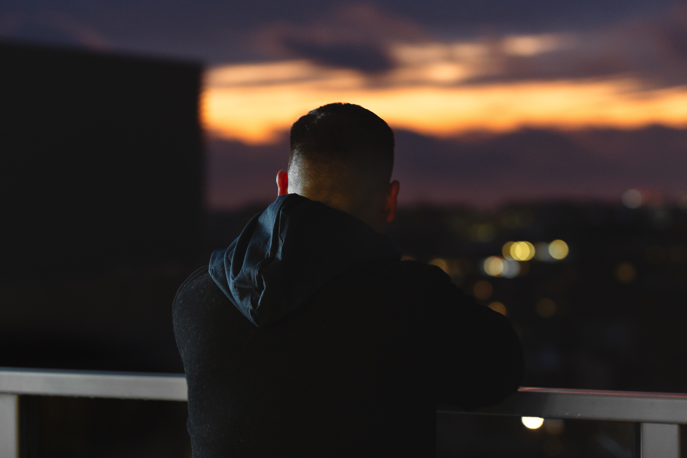 Andrew Weiss rooftop sunset silhouette